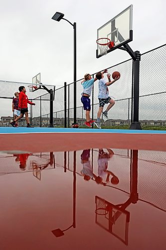 22082023
Friends Zach Nickel, Uan Lizada, Jordan Nickel and Spencer Simpson play basketball together at the Jumpstart Multi Sport Court on Maryland Avenue in Brandon&#x2019;s south end on a grey Tuesday. 
(Tim Smith/The Brandon Sun)