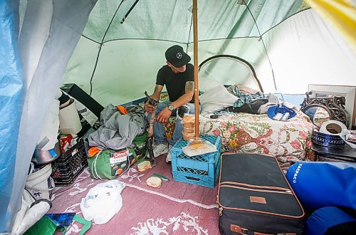JOHN WOODS / WINNIPEG FREE PRESS
Terry Johnsen, who was evicted from the Adanac Apartments on Sargent Ave., has set up camp on the Assiniboine River bank in Winnipeg Tuesday, August 22, 2023. Johnsen has been living there for two weeks eversince fired and water damaged his suite at the block.
Reporter: searle