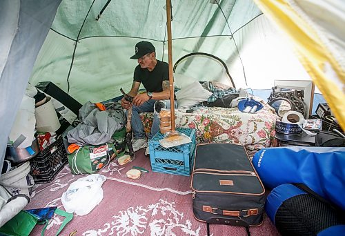 JOHN WOODS / WINNIPEG FREE PRESS
Terry Johnsen, who was evicted from the Adanac Apartments on Sargent Ave., has set up camp on the Assiniboine River bank in Winnipeg Tuesday, August 22, 2023. Johnsen has been living there for two weeks eversince fired and water damaged his suite at the block.
Reporter: searle