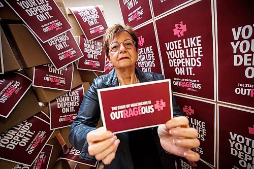 MIKE DEAL / WINNIPEG FREE PRESS
Darlene Jackson, MNU president, with posters and postcards for the campaign they are launching during the run up to the fall election to let people know what has been happening to health care.
230310 - Friday, March 10, 2023.