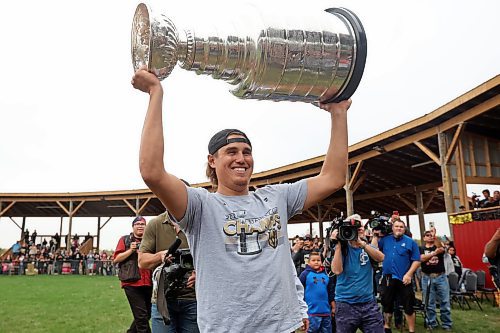 Defenceman Zach Whitecloud of the Vegas Golden Knights hoists the Stanley Cup as fans take photos at the Sioux Valley Dakota Nation powwow arbour on Wednesday (Photos by Tim Smith/The Brandon Sun)