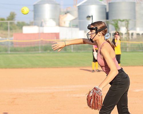 Addy Henwood of the under-13 Brandon Heat makes a short throw to third base during a recent practice. The team is competing in Softball Manitoba&#x2019;s under-13 AA provincial championship starting today at Ashley Neufeld Softball Complex. (Perry Bergson/The Brandon Sun)