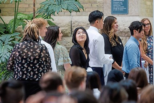 MIKE DEAL / WINNIPEG FREE PRESS
Jessica Li looks for family and friends in the crowd Wednesday morning during the Inaugural Day Exercises.
Family, friends and medical dignitaries gather in the Brodie Centre Atrium, Bannatyne Campus, 727 McDermot Avenue, for the University of Manitoba&#x2019;s Inaugural Day Exercises of the largest medical class in University of Manitoba history, the Class of 2027. The Max Rady College of Medicine will see 125 incoming medical students this coming year up from 110 students in recent years. During the event the new students take part in the White Coat Ceremony and recite the Physician&#x2019;s Pledge.
See Tessa Adamski story 
230823 - Wednesday, August 23, 2023.