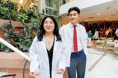 MIKE DEAL / WINNIPEG FREE PRESS
Jessica Li (left) and her brother Jeffrey Li (right).
Family, friends and medical dignitaries gather in the Brodie Centre Atrium, Bannatyne Campus, 727 McDermot Avenue, for the University of Manitoba&#x2019;s Inaugural Day Exercises of the largest medical class in University of Manitoba history, the Class of 2027. The Max Rady College of Medicine will see 125 incoming medical students this coming year up from 110 students in recent years. During the event the new students take part in the White Coat Ceremony and recite the Physician&#x2019;s Pledge.
See Tessa Adamski story 
230823 - Wednesday, August 23, 2023.