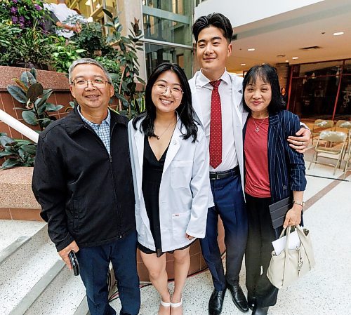 MIKE DEAL / WINNIPEG FREE PRESS
Siblings Jessica Li and Jeffrey Li with their parents, Rongyu Li (left) and Anxiu Su (right).
Family, friends and medical dignitaries gather in the Brodie Centre Atrium, Bannatyne Campus, 727 McDermot Avenue, for the University of Manitoba&#x2019;s Inaugural Day Exercises of the largest medical class in University of Manitoba history, the Class of 2027. The Max Rady College of Medicine will see 125 incoming medical students this coming year up from 110 students in recent years. During the event the new students take part in the White Coat Ceremony and recite the Physician&#x2019;s Pledge.
See Tessa Adamski story 
230823 - Wednesday, August 23, 2023.