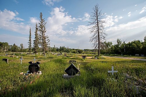 Daniel Crump / Winnipeg Free Press. Evan Caron&#x573; grave lays between that of his daughter and his cousin in the Gypsumville cemetery. Evan was shot and killed by police in Winnipeg in 2017. June 17, 2023.