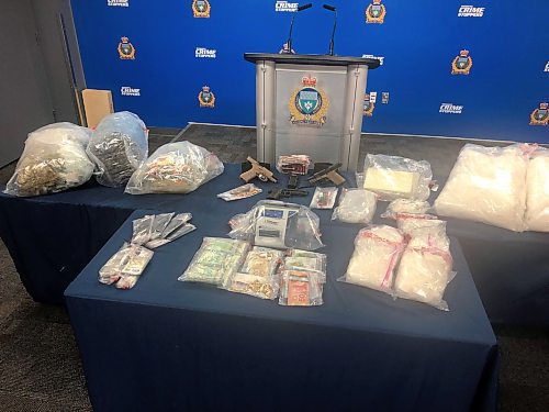 Police displayed drugs, guns, cash and other items seized. (Joyanne Pursaga / Winnipeg Free Press)
