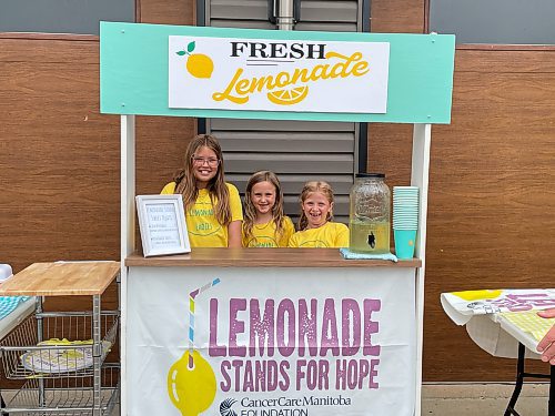 Ten-year-old Aria Elliott (left), Seven-year-old Éire Brennan (centre) and seven-year-old Etta Puppe (right) are part of the Lemonade Ladies. They'll be operating a lemonade stand outside the Westoba Credit Union branch in Rivers from 10 a.m. to 2 p.m. on Saturday to raise money for CancerCare Manitoba. (Colin Slark/The Brandon Sun)