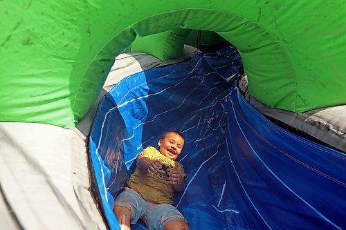 24082023
Children take turns playing on a bouncy waterslide during Dakota Tiwahe Days at Sioux Valley Dakota Nation&#x2019;s Grand Valley Park outside Brandon on Thursday. The family days began Tuesday and wrap up today with an Amazing Race style scavenger hunt. Some of the other events included horse riding, laser tag, archery and a dance party.
(Tim Smith/The Brandon Sun)