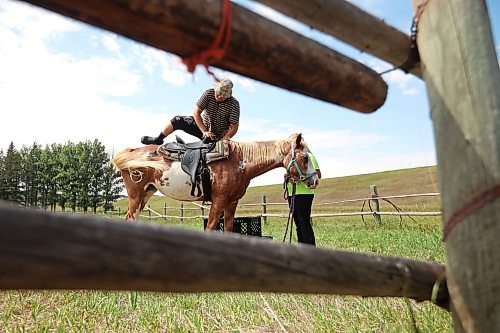 24082023
Zach St. Pierre - Scott of Swan Lake First Nation takes a horse ride led by Jayla West during Dakota Tiwahe Days at Sioux Valley Dakota Nation&#x2019;s Grand Valley Park outside Brandon on Thursday. The family days began Tuesday and wrap up today with an Amazing Race style scavenger hunt. Some of the other events included horse riding, laser tag and a dance party.
(Tim Smith/The Brandon Sun)