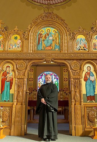 Father Michael Kwiatkowski poses for a photo in the Holy Eucharist Ukrainian Catholic Church in Winnipeg in April 2014. (Crystal Schick/Winnipeg Free Press)