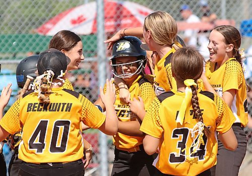 Londyn Hrubeniuk of the Westman Heat, shown in the centre in the batting helmet, is mobbed by teammates after hitting a home run  during the fourth inning of Softball Manitoba’s under-13 AA girls provincial championship at Brandon’s Ashley Neufeld Softball Complex on Sunday afternoon. The Heat won 8-5. (Perry Bergson/The Brandon Sun)
Aug. 27, 2023
