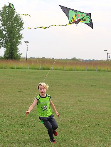 Hayden Strohman flies his kite at the Riverbank Discovery Centre grounds on Saturday during Brandon’s first Indian kite festival. (Kyle Darbyson/The Brandon Sun)