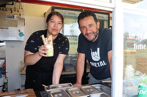 Jocelyn Shlachetka and Enrique Martell serve up some chicken flautas in a cup during Mariachi Mexican Tacos’ visit to Dinsdale Park this past Saturday. (Kyle Darbyson/The Brandon Sun)