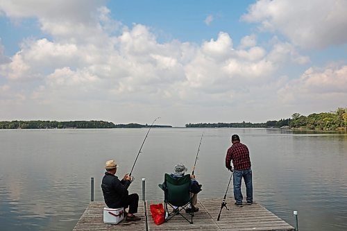 28082023
Friends Bert Bautista, Renato Blanco and Ben Clarete of Winnipeg fish together from a dock on Killarney Lake on a sunny Monday. 
(Tim Smith/The Brandon Sun)