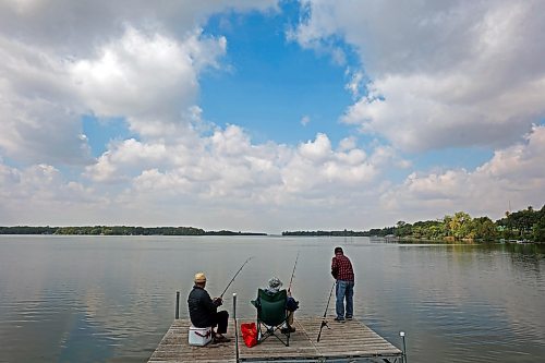 28082023
Friends Bert Bautista, Renato Blanco and Ben Clarete of Winnipeg fish together from a dock on Killarney Lake on a sunny Monday. 
(Tim Smith/The Brandon Sun)