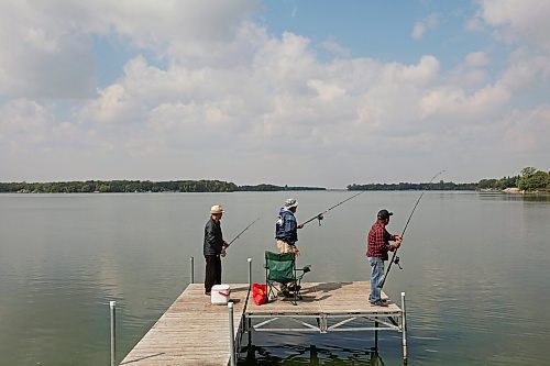 28082023
Friends Bert Bautista, Renato Blanco and Ben Clarete of Winnipeg fish together from a dock on Killarney Lake on a sunny Monday. 
(Tim Smith/The Brandon Sun)