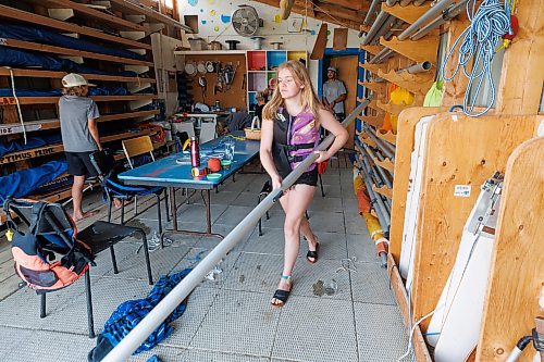 MIKE DEAL / WINNIPEG FREE PRESS
Breanna Stephenson, 14, takes gear down to the shore for the learn to sail class at the Pelican Yacht Club on Pelican Lake in the town of Ninette, MB.
See Ben Waldman story
230815 - Tuesday, August 15, 2023.