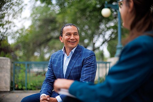 MIKE DEAL / WINNIPEG FREE PRESS
Leader of the Manitoba NDP, Wab Kinew, sits down with reporter Danielle DaSilva for an interview on the south grounds of the Manitoba Legislative building Tuesday morning.
230829 - Tuesday, August 29, 2023.