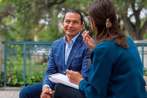 MIKE DEAL / WINNIPEG FREE PRESS
Leader of the Manitoba NDP, Wab Kinew, sits down with reporter Danielle DaSilva for an interview on the south grounds of the Manitoba Legislative building Tuesday morning.
230829 - Tuesday, August 29, 2023.