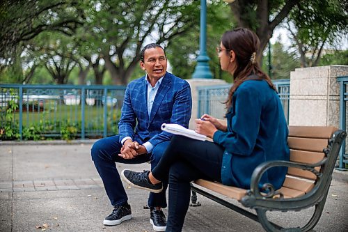 MIKE DEAL / WINNIPEG FREE PRESS
Leader of the Manitoba NDP, Wab Kinew, sits down with reporter Danielle DaSilva for an interview on the south grounds of the Manitoba Legislative building Tuesday morning.
230829 - Tuesday, August 29, 2023.