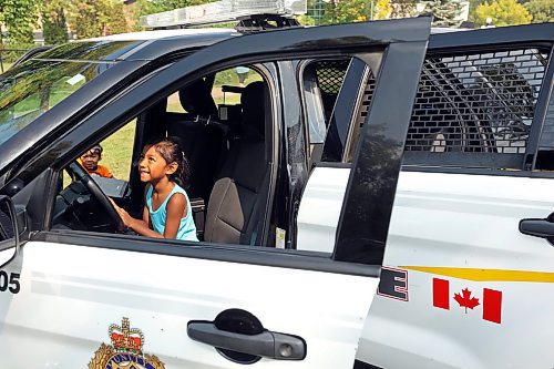 29082023
Sophiia Aunay plays in the drivers seat of a Brandon Police Service cruiser during a free BBQ hosted by BPS at Stanley Park on Tuesday.
(Tim Smith/The Brandon Sun)