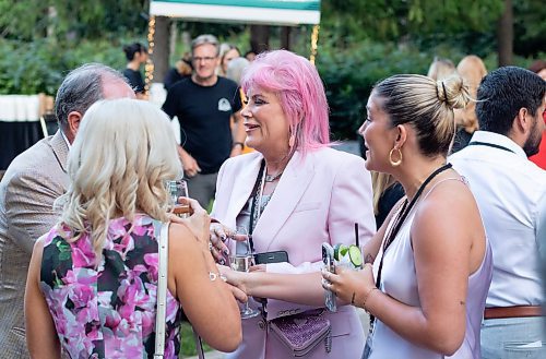 Mike Thiessen / Winnipeg Free Press 
A group of friends catch up at the 2023 Garden Party at Assiniboine Park, a fundraiser for the park. The theme of this year&#x2019;s event was magic, with tarot card reading and magicians. 230830 &#x2013; Wednesday, August 30, 2023