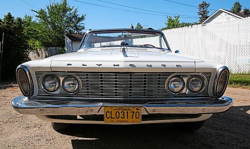 The front chrome grill showing the four headlights with the turn signals mounted high on the fenders on Ann and Keith Watt's 1963 Plymouth Fury convertible in Brandon on Thursday. (Michele McDougall/The Brandon Sun)