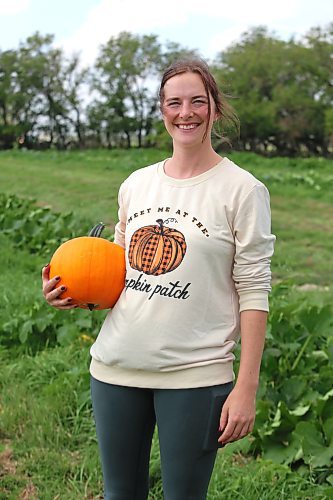 Kristelle Harper showcases some of the pumpkins that her team has been growing west of Brandon during a tour of the Solar Nutrition farm Thursday afternoon. Solar Nutrition's U-Pick pumpkin patch will be open to the public starting Sept. 16. (Kyle Darbyson/The Brandon Sun)