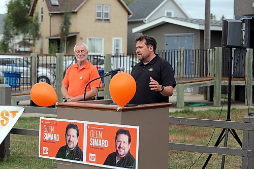 Brandon East NDP candidate Glen Simard (right) introduces himself at the opening of his campaign office at the East End Community Centre on Thursday as Brandon West NDP candidate Quentin Robinson (left) looks on. (Colin Slark/The Brandon Sun)