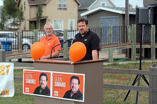 Brandon East NDP candidate Glen Simard (right) introduces himself at the opening of his campaign office at the East End Community Centre on Thursday as Brandon West NDP candidate Quentin Robinson (left) looks on. (Colin Slark/The Brandon Sun)