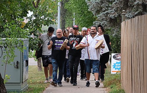 Drummers Murray Smith, from left, Sam Jackson and Chris Deleurme lead the march down Victoria Avenue on Thursday afternoon to mark International Overdose Awareness Day in Brandon. The three men are part of the Akitica Cante Waste &#x460;or what Deleurme called the Good Hearted Warriors. (Matt Goerzen/The Brandon Sun)