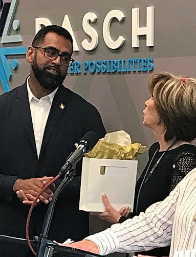 CAROL SANDERS / WINNIPEG FREE PRESS

Sport, Culture and Heritage Minister Obby Khan at DASCH press conference presented with thank-you gift by DASCH Foundation chairperson Karen Menkis for $1 million grant province awarded to the non profit agency last month.  August 31, 2023