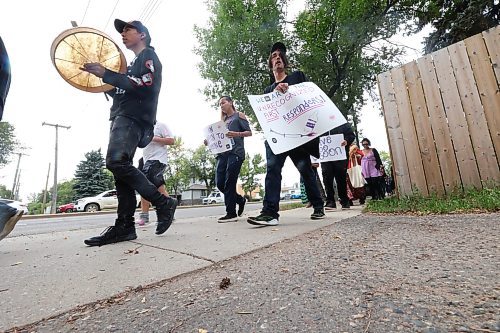 Participants of a march in honour of International Overdose Awareness Day walk down Victoria Avenue on Thursday afternoon from Princess Park. (Matt Goerzen/The Brandon Sun)