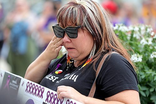 RUTH BONNEVILLE / WINNIPEG FREE PRESS

LOCAL - OD RALLY

Angela Brass, with Ka Ni Kanichihk, tears up as she listens to speakers at event. 

International Overdose Awareness Day took place at Legislature steps with Arlene Last-Kolb from MSTH and OAM speaking, along with other supporters Thursday. 

August 31st, 2023

