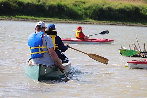 Jonathan Ferguson sets sail on a Assiniboine River canoe/kayak expedition alongside his boys Joseph, William and Michael (not pictured) on a sweltering Friday afternoon in Brandon. The Fergusons are looking to make the most of the Labour Day long weekend since the return of school is right around the corner. (Kyle Darbyson/The Brandon Sun)