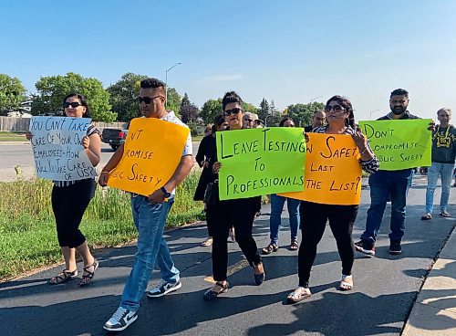 MALAK ABAS / WINNIPEG FREE PRESS

Driving instructors gather at the MPI centre on Bison Drive today to protest and march with striking workers Friday morning. 
September 1, 2023.