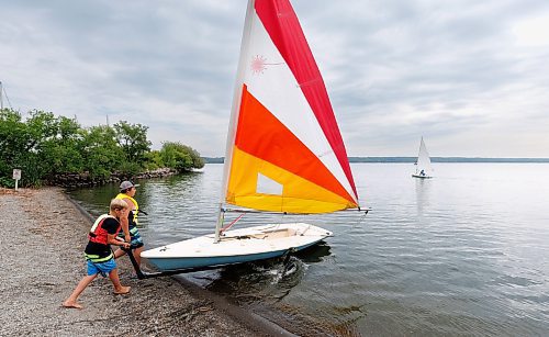 MIKE DEAL / WINNIPEG FREE PRESS
Ben&#xa0;Schwartz (right), 13, and Jace&#xa0;Garabed (left), 10, put a boat into the water for their learn to sail class at the Pelican Yacht Club on Pelican Lake in the town of Ninette, MB.
See Ben Waldman story
230815 - Tuesday, August 15, 2023.