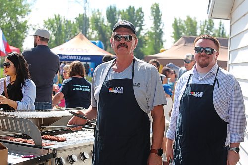 UFCW Local 832 members Dean Rodwell and Dustin Rogers man the grill during a Labour Day barbecue that took place at the union’s headquarters in Brandon. (Kyle Darbyson/The Brandon Sun)