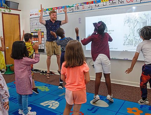 Mike Deal / Winnipeg Free Press
St. George School Kindergarten teacher, Ken Benson, and his students pantomime during a song, Monday, June 12, 2023.
See Maggie Macintosh story
230612 - Monday, June 12, 2023.