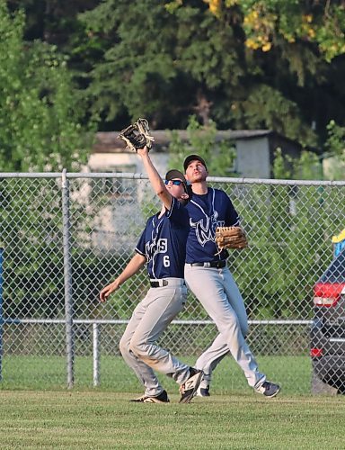 Austin Taylor, an 18-year-old Minnedosa product, settles under a fly ball under the watchful eye of Minnedosa Mavericks veteran centrefielder Josh McInnes. (Perry Bergson/The Brandon Sun)