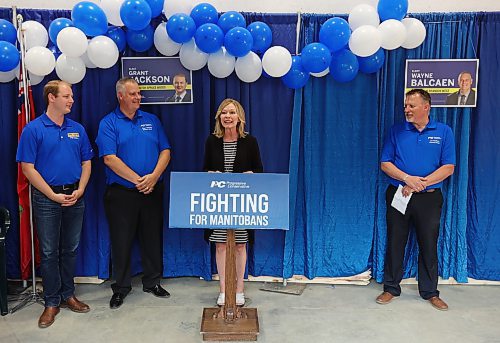 Progressive Conservative provincial campaign co-chair Candice Bergen speaks during the grand opening of the PC campaign office at 382 Park Ave. East for local candidates Grant Jackson of Spruce Woods (left), Wayne Balcaen of Brandon West (second from left) and Len Isleifson of Brandon East (right) on Tuesday evening. See story on Page A5. (Tim Smith/The Brandon Sun)