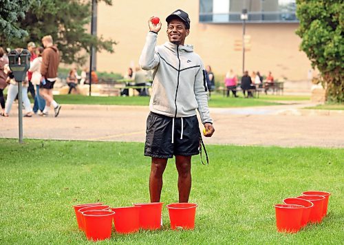 05092023
Brandon University student Khari Ojeda-Harvey plays a large and alcohol-free version of beer pong during a free BBQ lunch put on by BU for Orientation Day on Tuesday. The day for new and returning BU students included a variety of games, challenges, activities and information sessions.
(Tim Smith/The Brandon Sun)