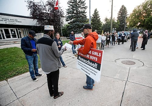 JOHN WOODS / WINNIPEG FREE PRESS
People gather in support of a suspended school trustee at Louis Riel School Division office on Monterey Road in Winnipeg Tuesday, September 5, 2023. Francine Champagne, a school trustee, was suspended recently for allegedly posting controversial content.

Reporter: macintosh