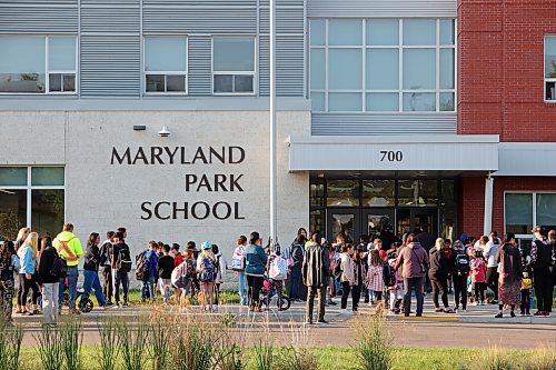 Students and parents wait outside Maryland Park School for the bell to ring on Wednesday morning for the first day of classes. (Photos by Tim Smith/The Brandon Sun) 