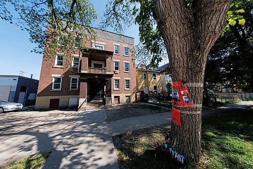 MIKE DEAL / WINNIPEG FREE PRESS
A memorial, for Cory Roger Roullete, 38, is taped to the tree outside the building where he was killed, 583 Furby Street.  
See Tyler Searle story
230830 - Wednesday, August 30, 2023.