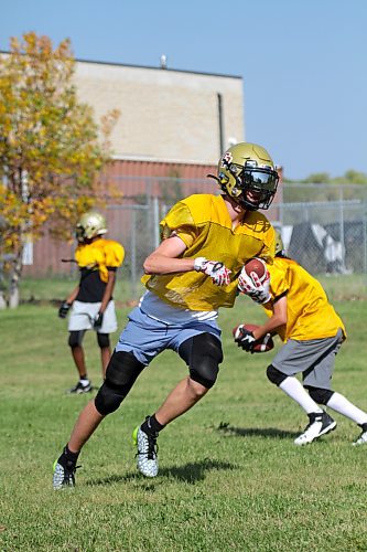 Simon Leckie runs with the ball during a Crocus Plainsmen football practice on Wednesday. The team opens its Winnipeg High School Football League season on Friday at St. Paul's. (Thomas Friesen/The Brandon Sun)