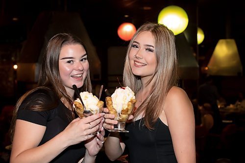 BROOK JONES / WINNIPEG FREE PRESS
L-R: Brookelynn Blanco, who is a marketing coordinator with Lakeview Hotels &amp; Resorts, and her cousin Hailey Foster show-off a dessert called banana tempura whiling dining at the Ichiban Japanese Steakhouse in Winnipeg, Man., Wednesday, Sept. 6, 2023. The Japanese steakhouse at 185 Carlton Street is celebrating its 50th anniversary. 
