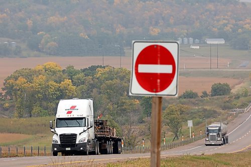 07092023
Trucks make their way along the Trans Canada Highway west of Brandon on Thursday.
(Tim Smith/The Brandon Sun)