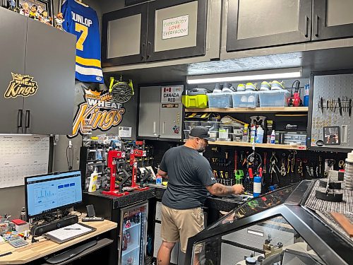 Equipment manager Scott Hlady works in his new office, which was previously used to store equipment. (Perry Bergson/The Brandon Sun)